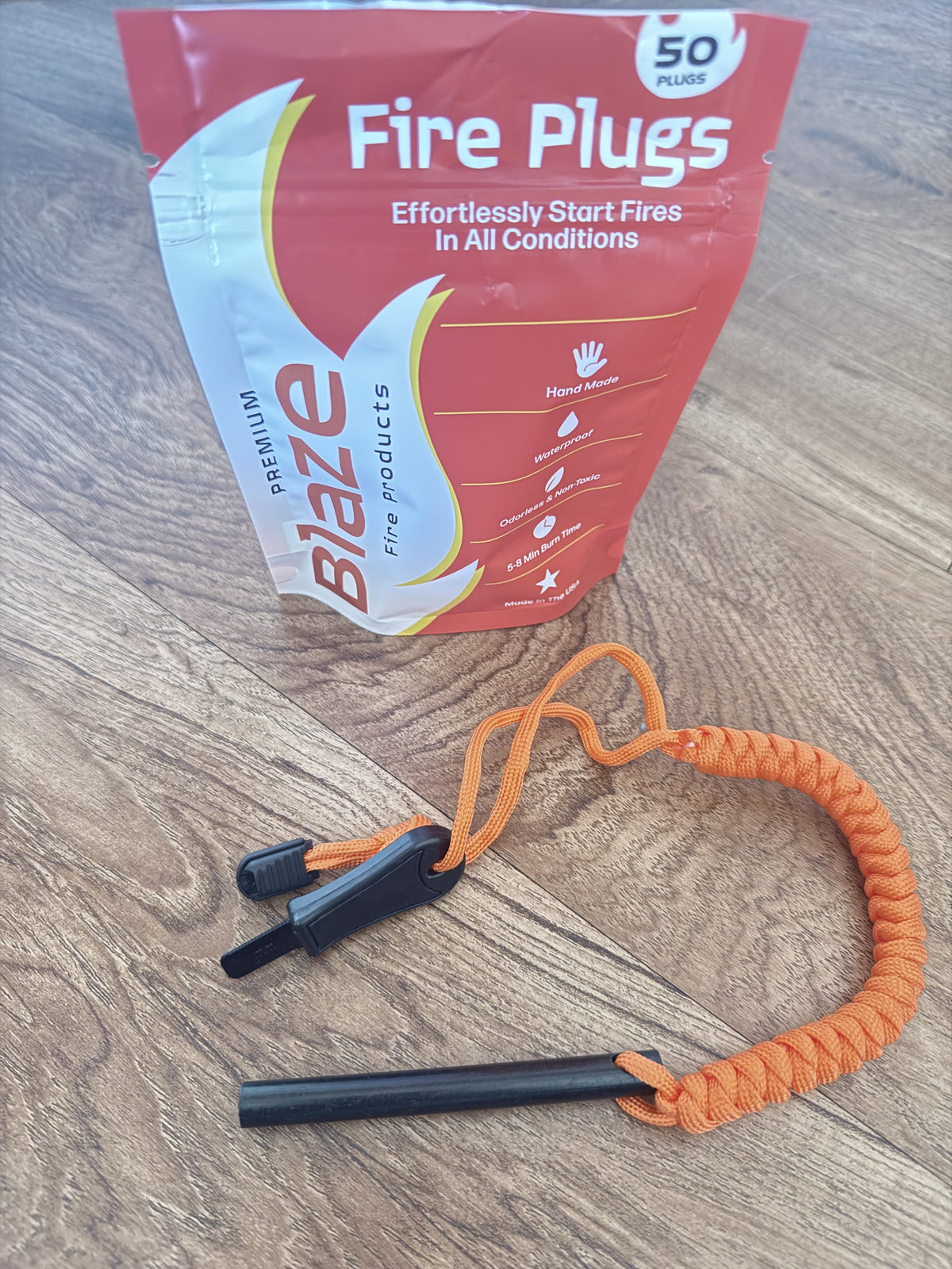 Blaze Fire Plugs pouch with ferro rod, striker and orange paracord lanyard