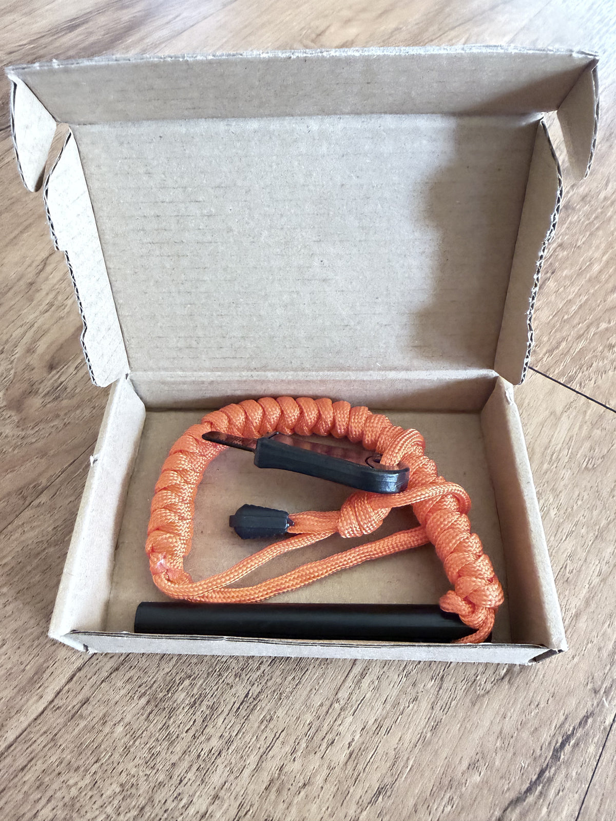 Blaze ferro rod, striker and orange paracord lanyard in kraft mailer box
